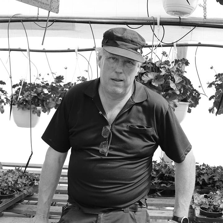 Holding computer showing demo of software